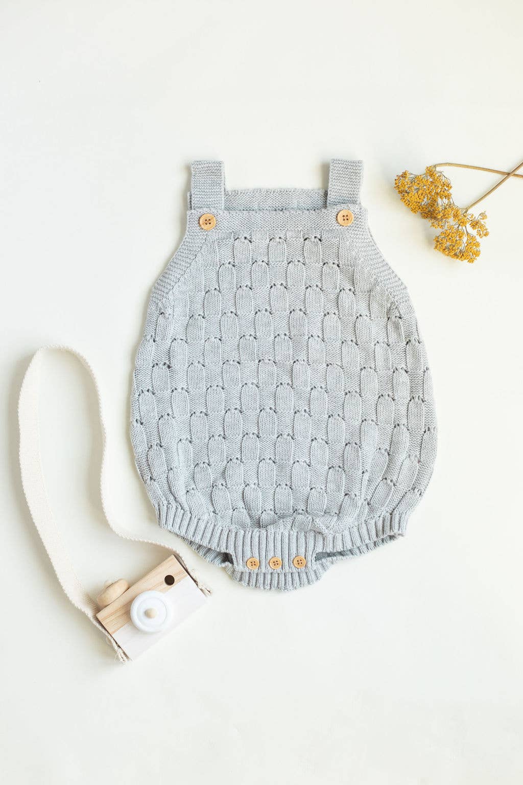 Knitted romper with buttons